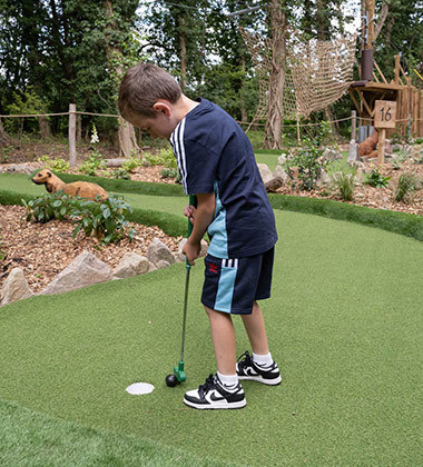 Kid playing golf